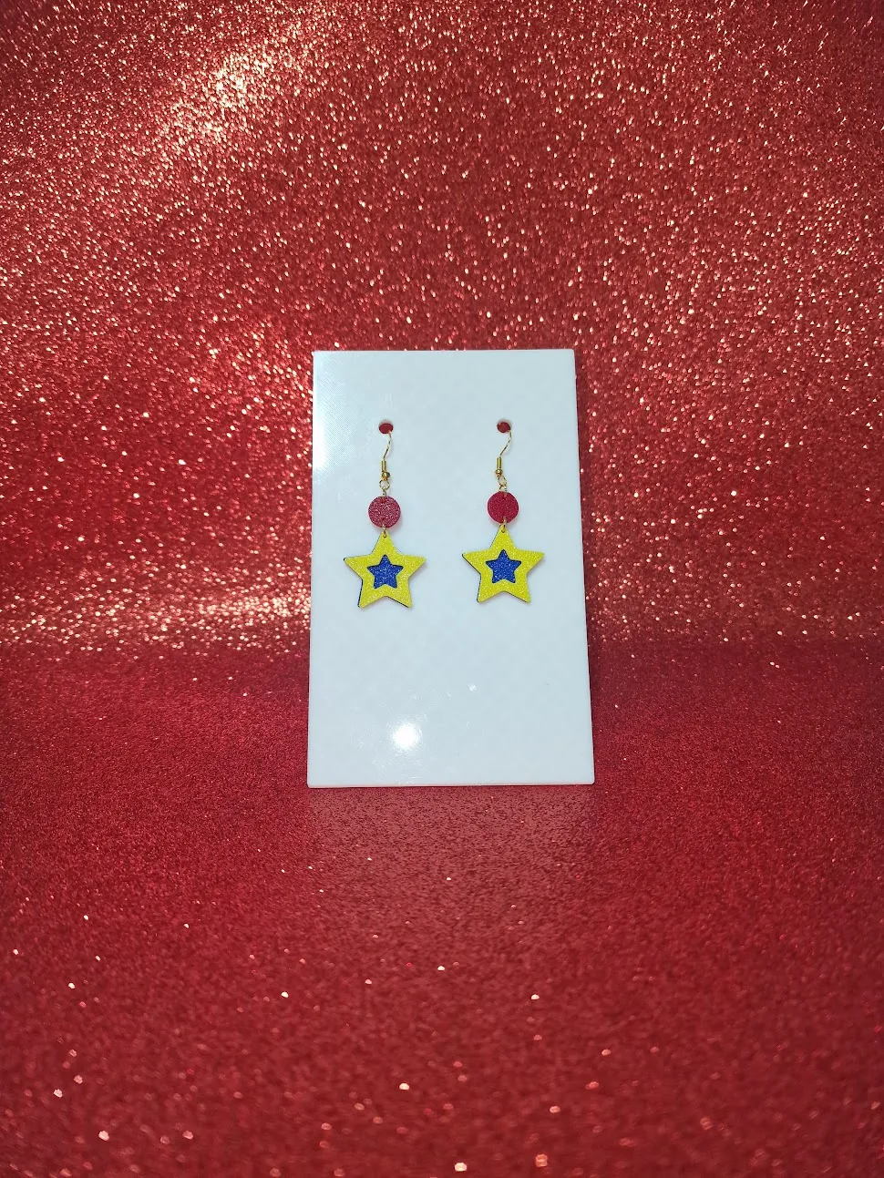 Blue and yellow star earrings view 2