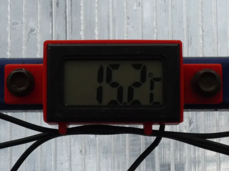 An overhead box for an electronic thermometer .
