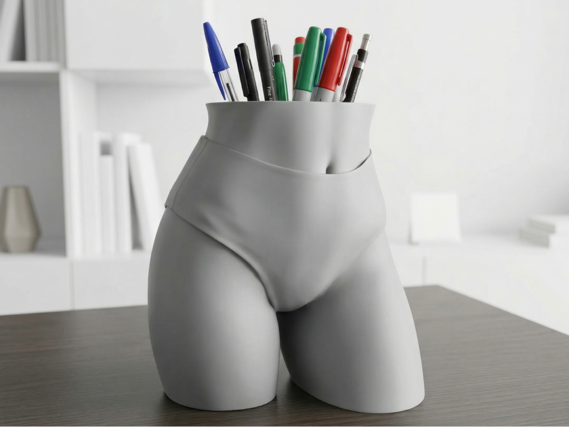 Female hips as a pencil holder or vase
