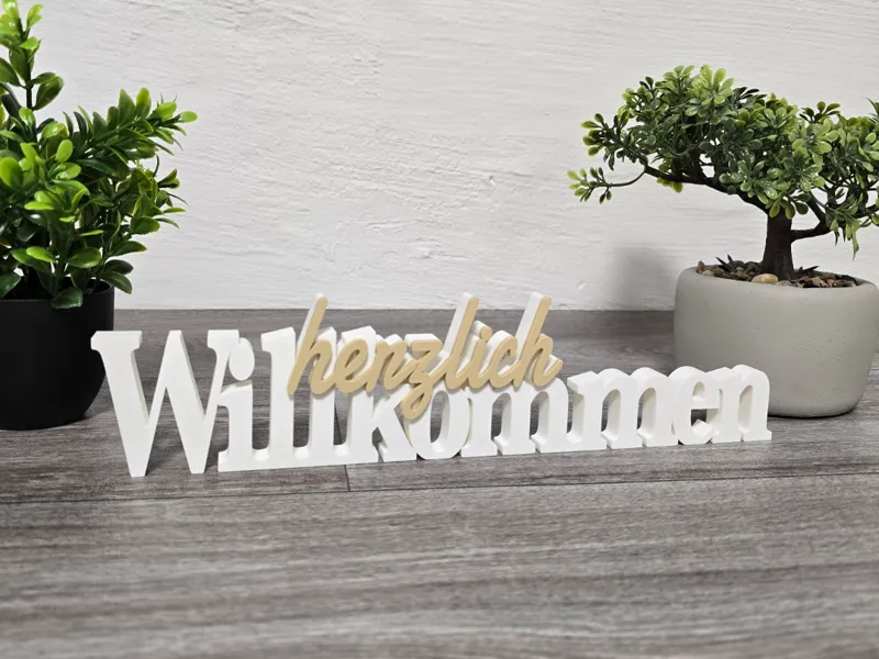 Herzlich willkommen Schriftzug