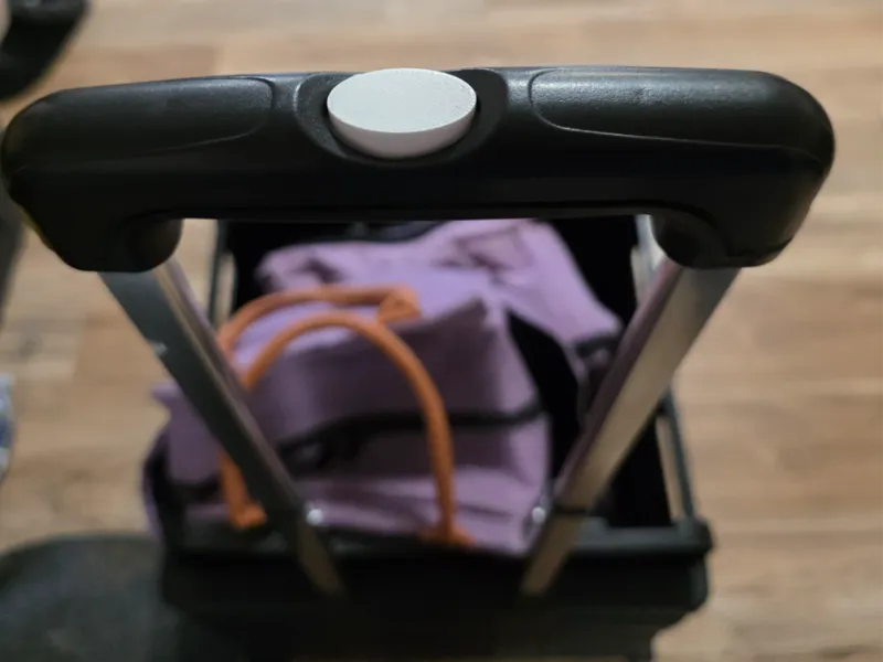 Push button for collapsible cart handle