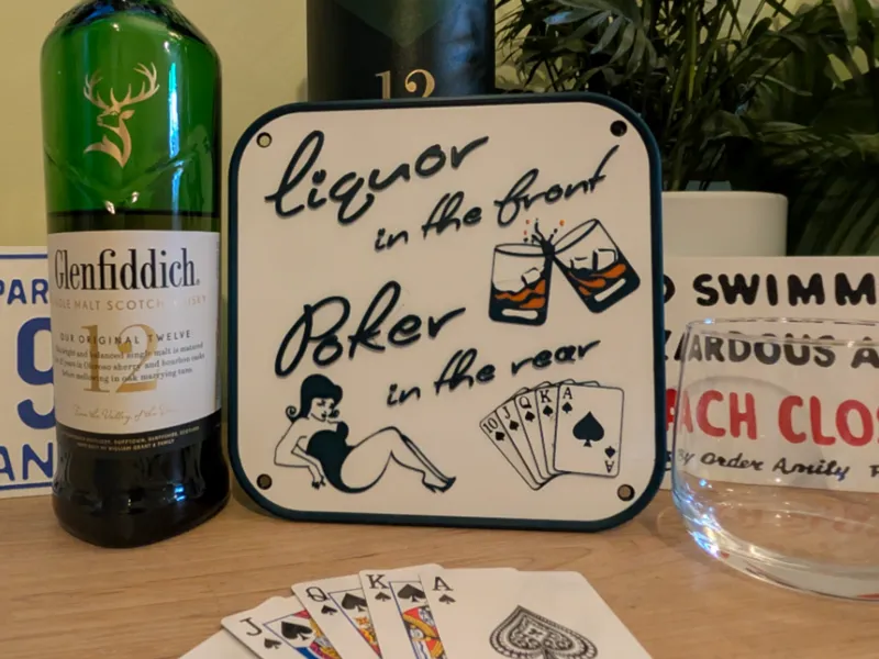 "Liquor in the front" Bar sign