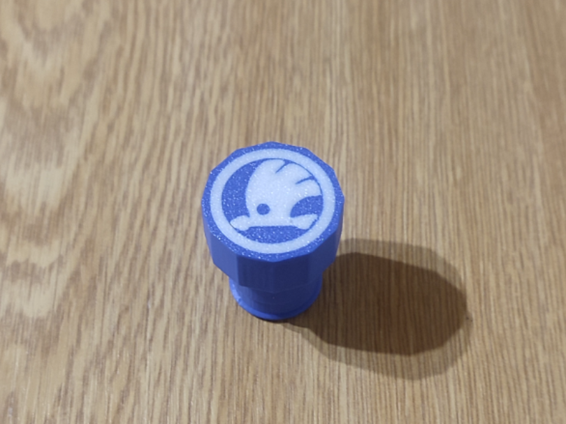 Socket cover with Škoda logo