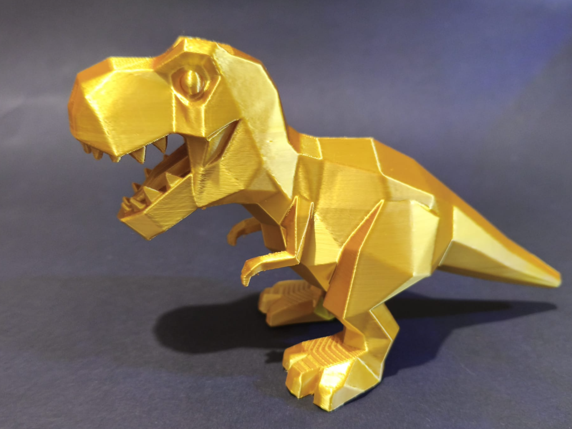 Geometric Golden Low-Poly T-Rex Statue