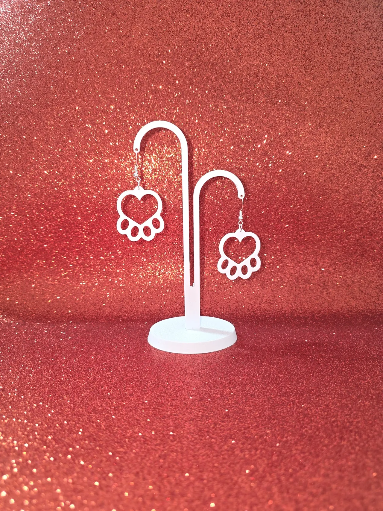 Heart in paw earrings view 3