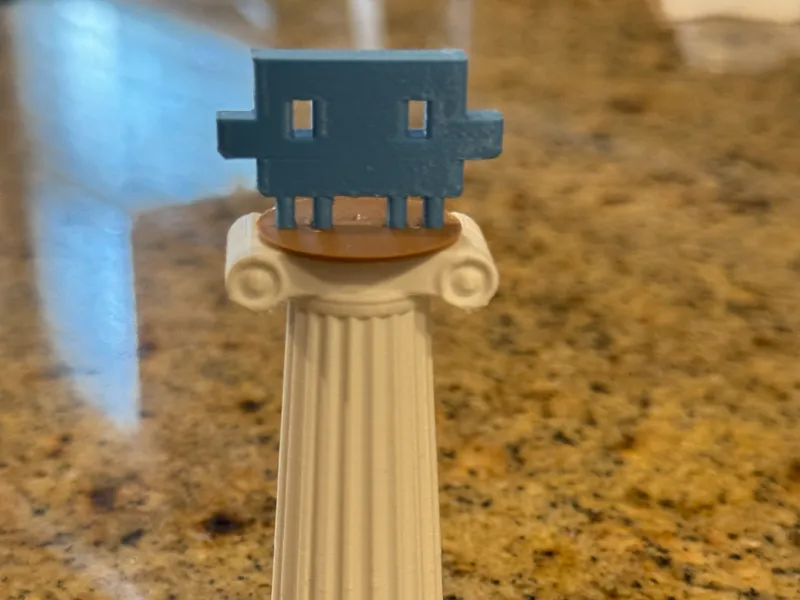Column of Claw'd / Claude Logo on Roman Column