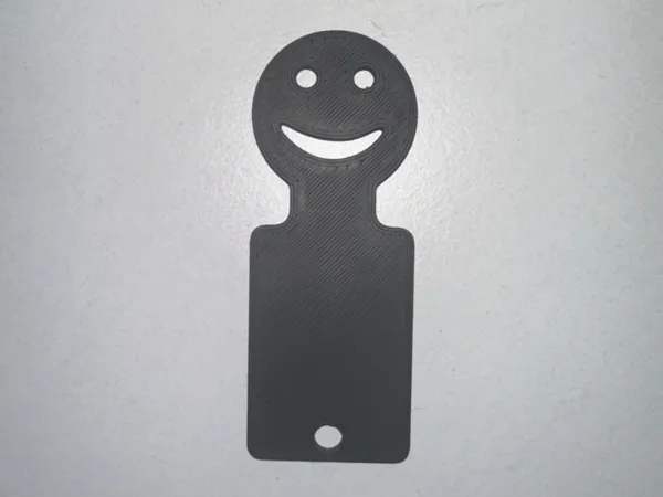 Jeton de caddie souriant
