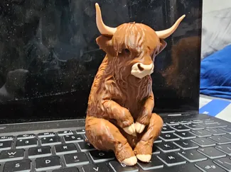 Highland Cow Sitting Patiently AI Generated