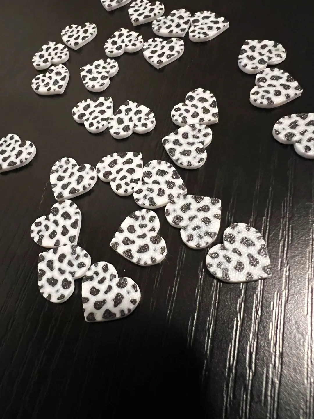 Cow print heart stud earrings view 2
