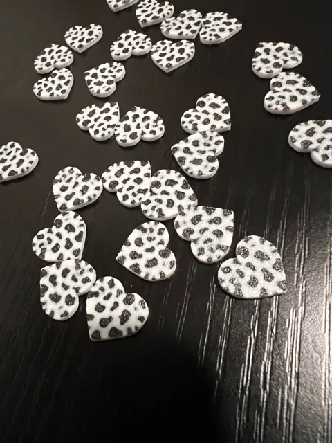Cow print heart stud earrings view 2