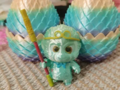 A chibi green monkey, very much like Goku