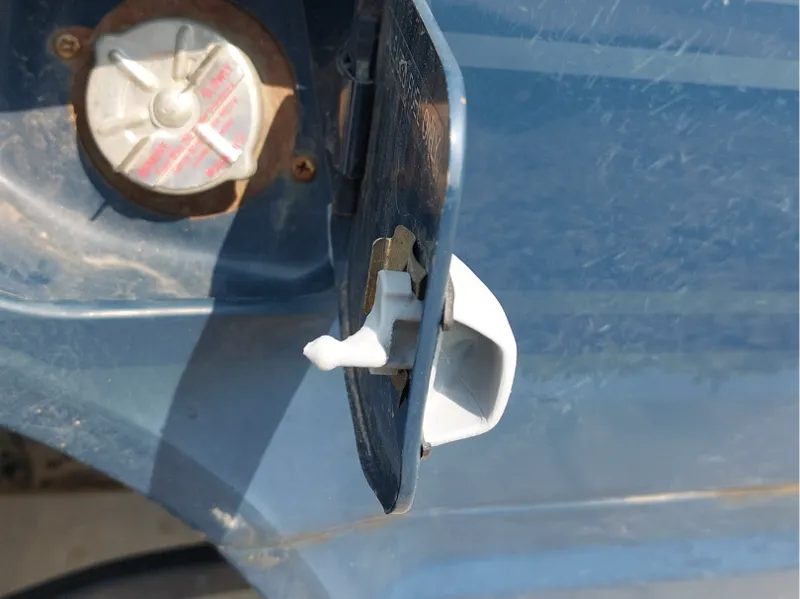 Nissan/ Datsun fuel door latch exterior