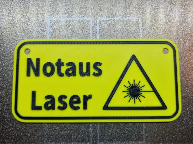 Laser Hinweisschild für Notaus Schalter