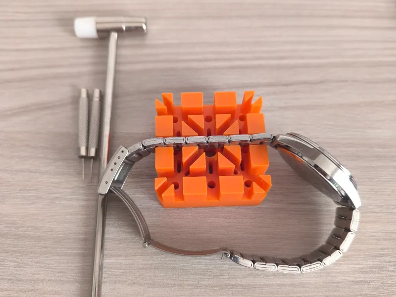 Watch strap pin removal support / base