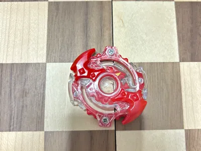 lunior 2 beyblade along wit Alkalyzer beyblade top