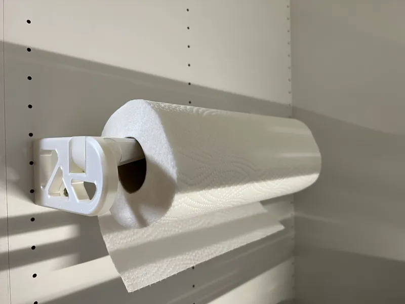 Paper towel holder with screw holes