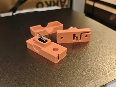 Microswitch holder with wire lock.