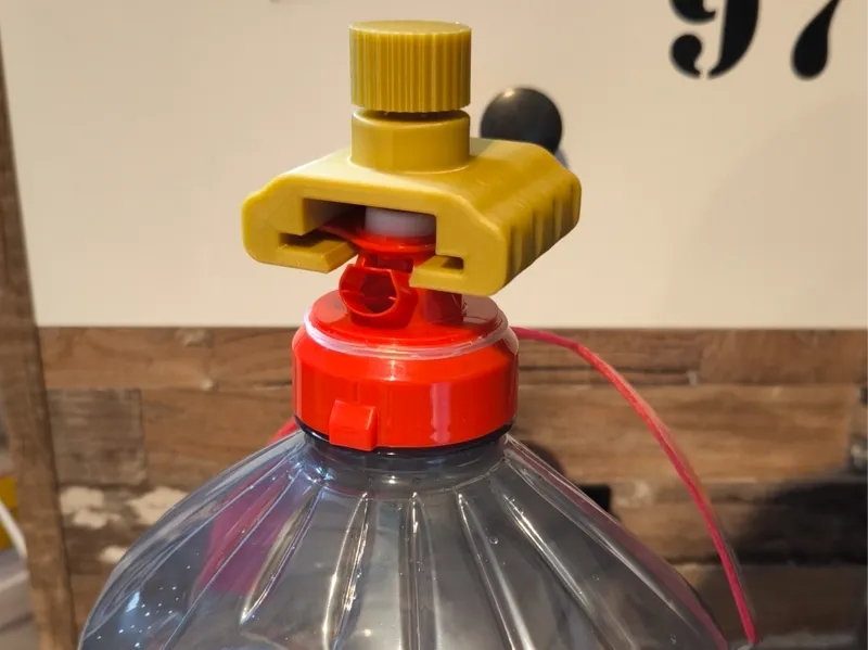 Poussoir de bouchon de grande bouteille