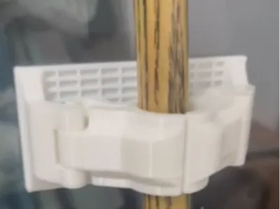 Pool cue holder, stand, remixed from MXDesign's broom hook. This version is designed to be secured with double-sided adhesive tape, and the adhesive surface has been intentionally enlarged
