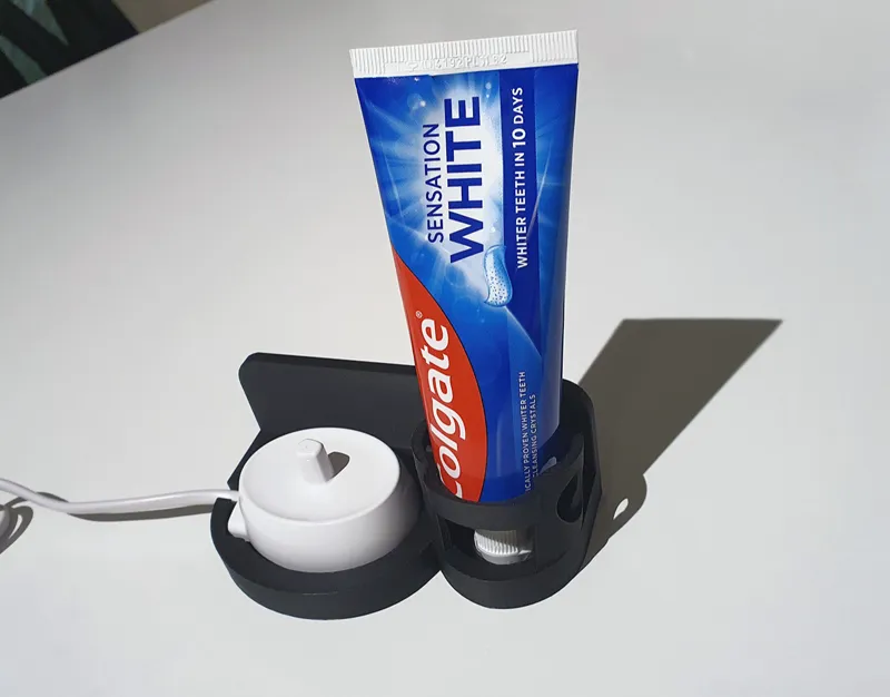 Wall mount for Oral B base and toothpaste