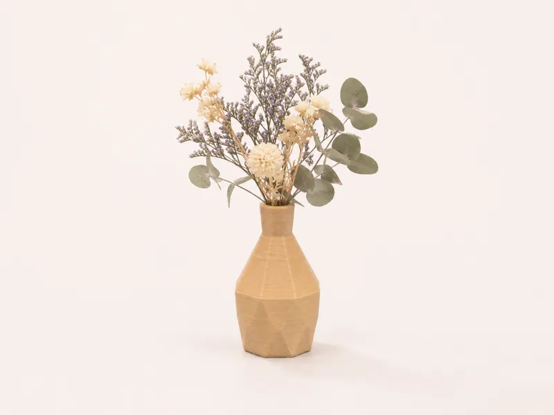 A mini vase suitable for a dollhouse.
