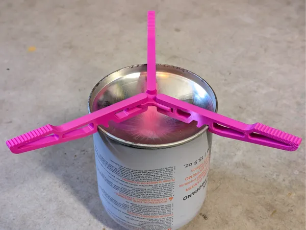 Support pliant pour réchaud à isobutane