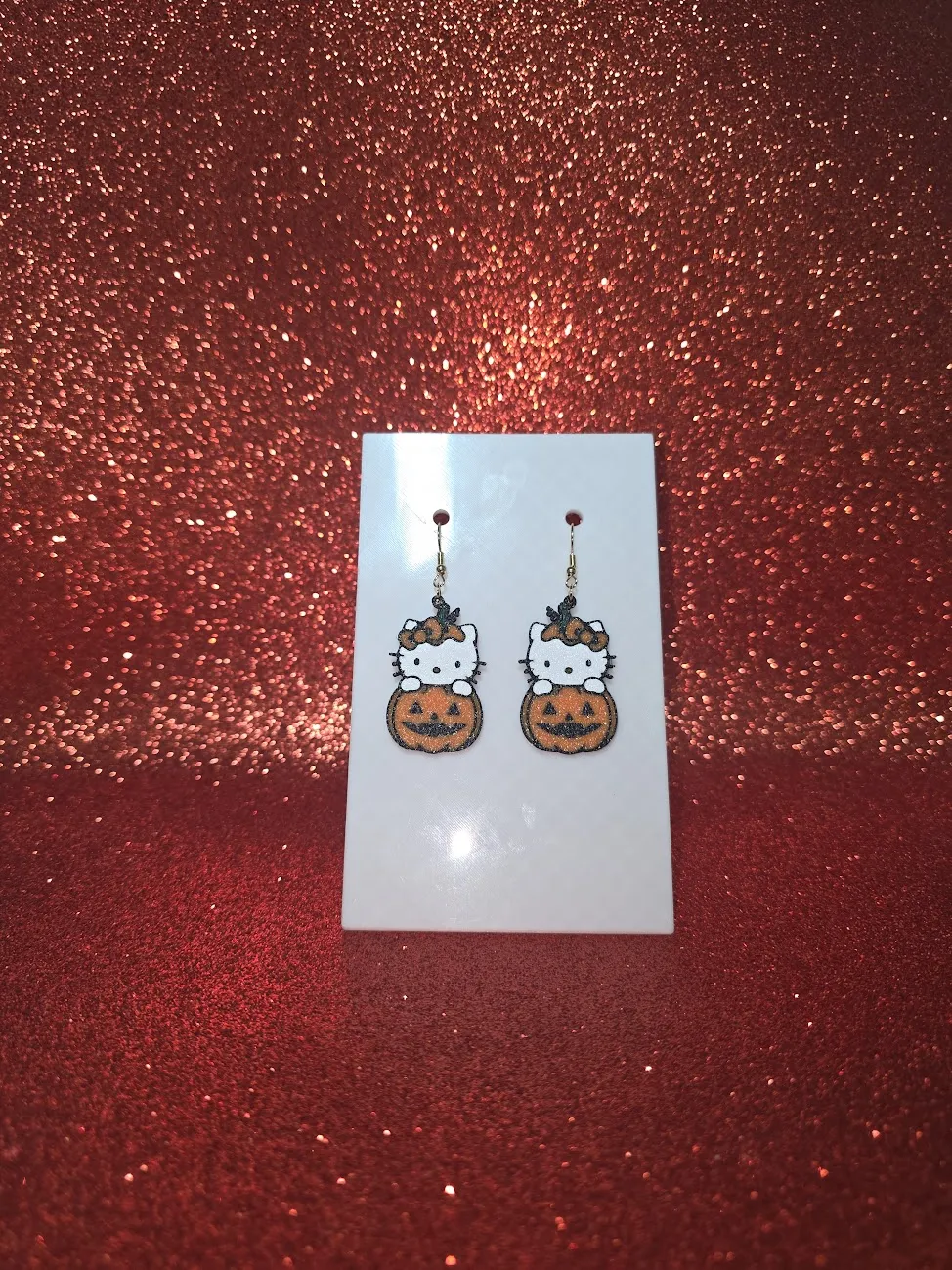 Hello Kitty pumpkin earrings view 2