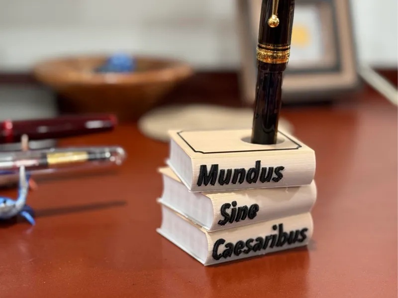 "Mundus Sine Caesaribus" — Stacked Books Pen Stand
