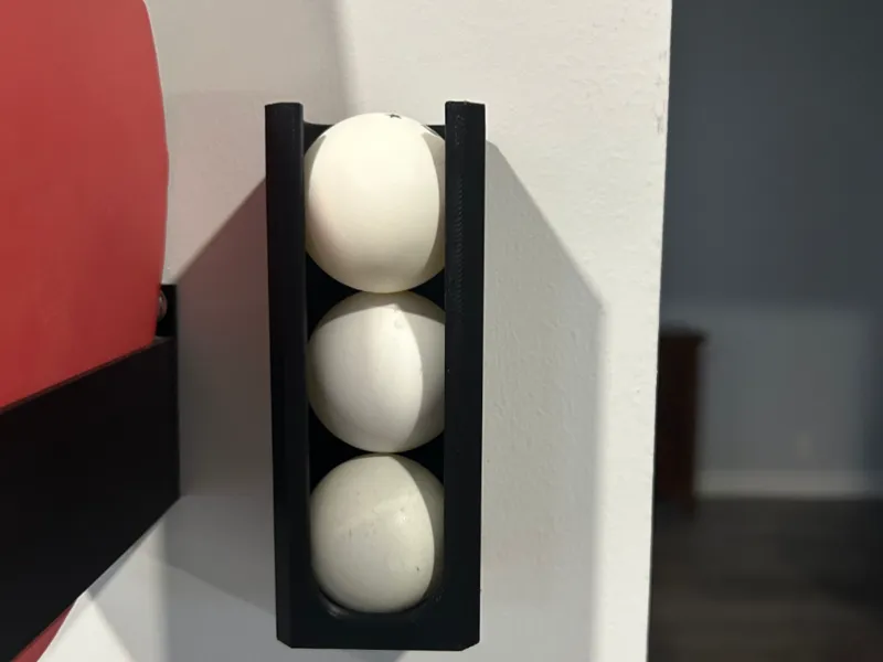 Wall mounted ping pong ball holder