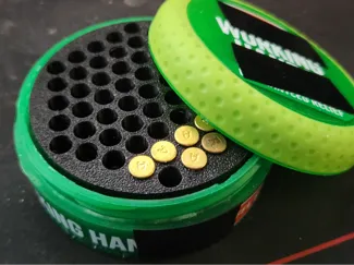 Hand cream recycled into .22 LR ammo case adapter.