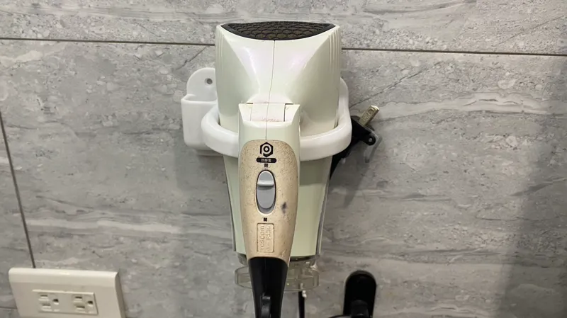 Bathroom hair dryer rack