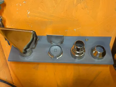 Wall-mounted phone accessory holder