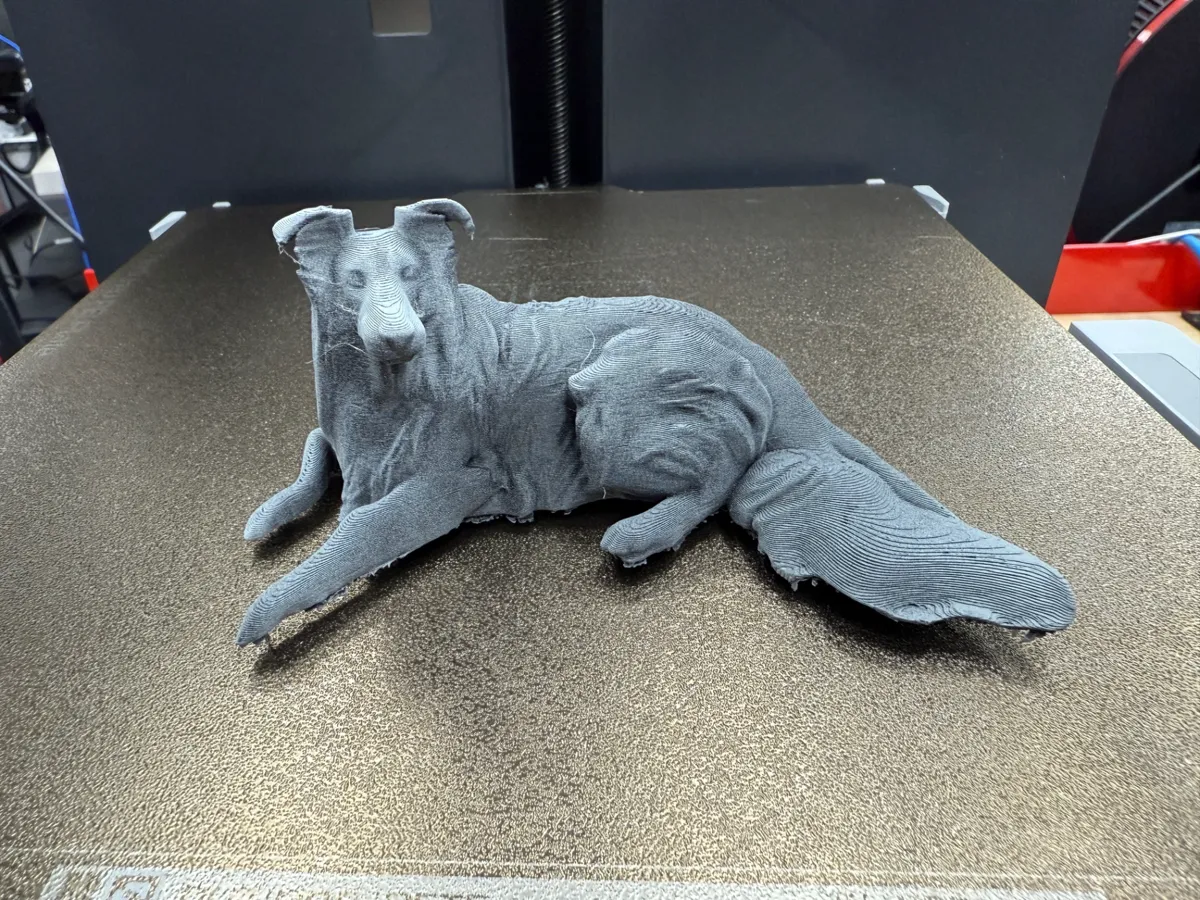 Figurine de colley couché
