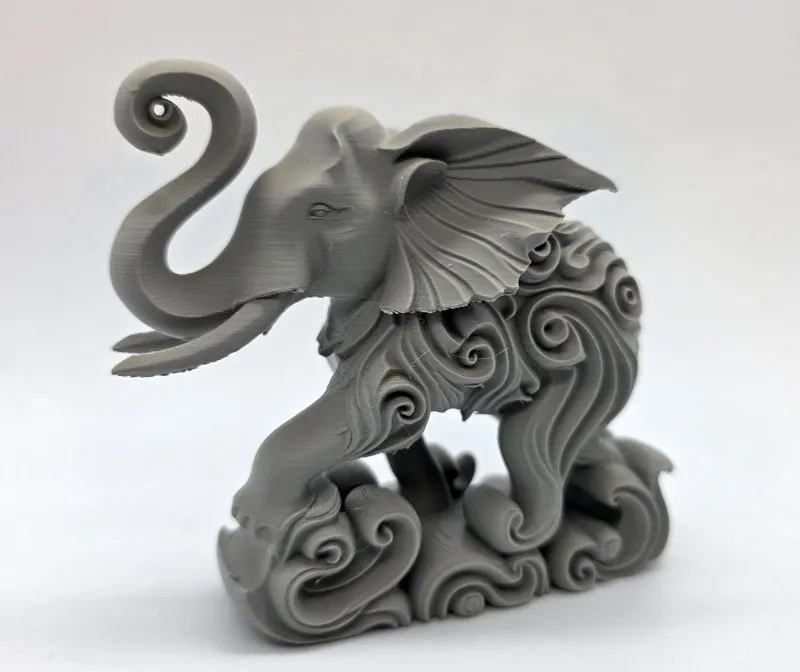 Swirl-Carved Elephant Splashing Sculpture