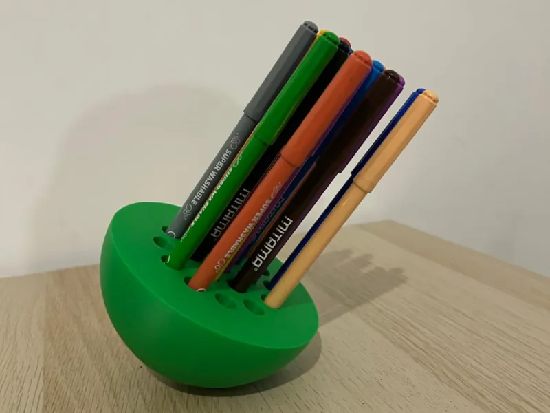 self-balancing wobbly pen stand & AAA battery bay