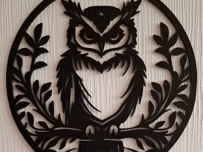 circular silhouette of an owl