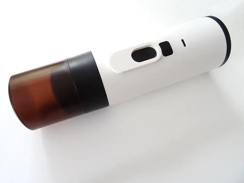 Button guard for portable espresso machine