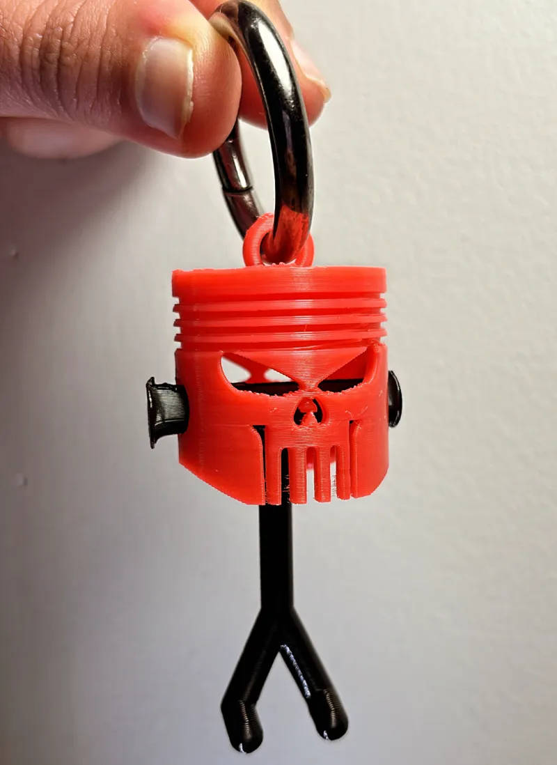Swinging Punisher Piston Keychain