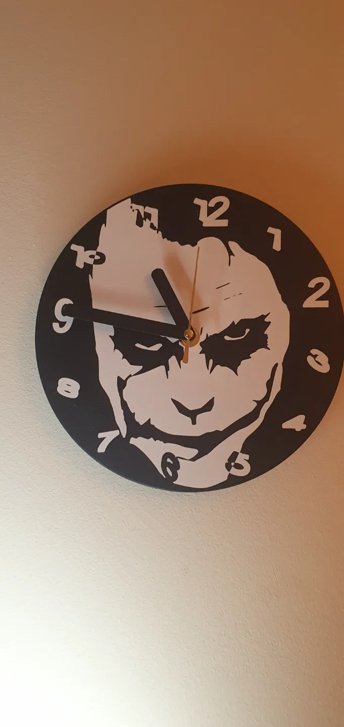 Joker clock with clock mechanism housing.