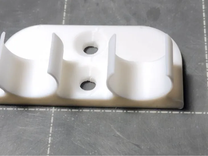 .65"dia syringe holder. Grease and oil. wall mount