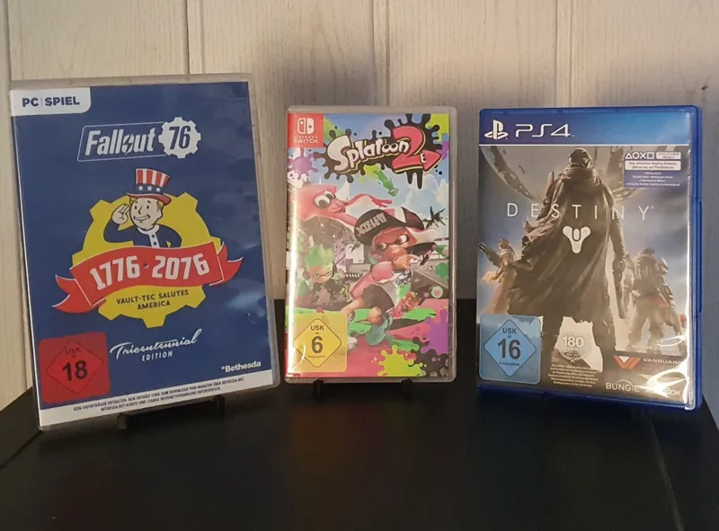 Stand for games cassettes rate cards and more