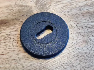Keyhole cover that covers screws