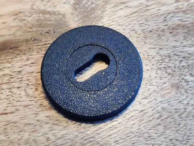 Keyhole cover that covers screws