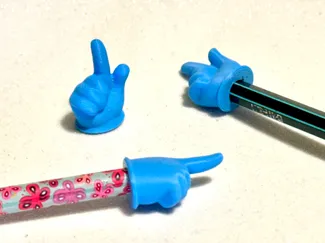 Pointing finger pencil cap