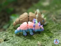 3 small multicolored triceratops