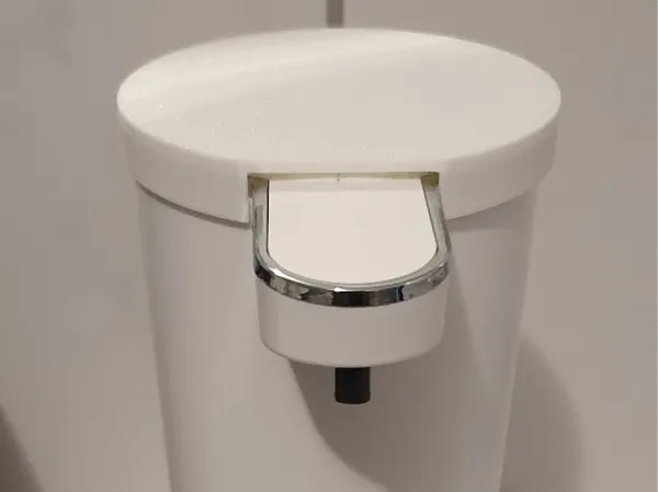 Cache protecteur pour distributeur de savon moussant