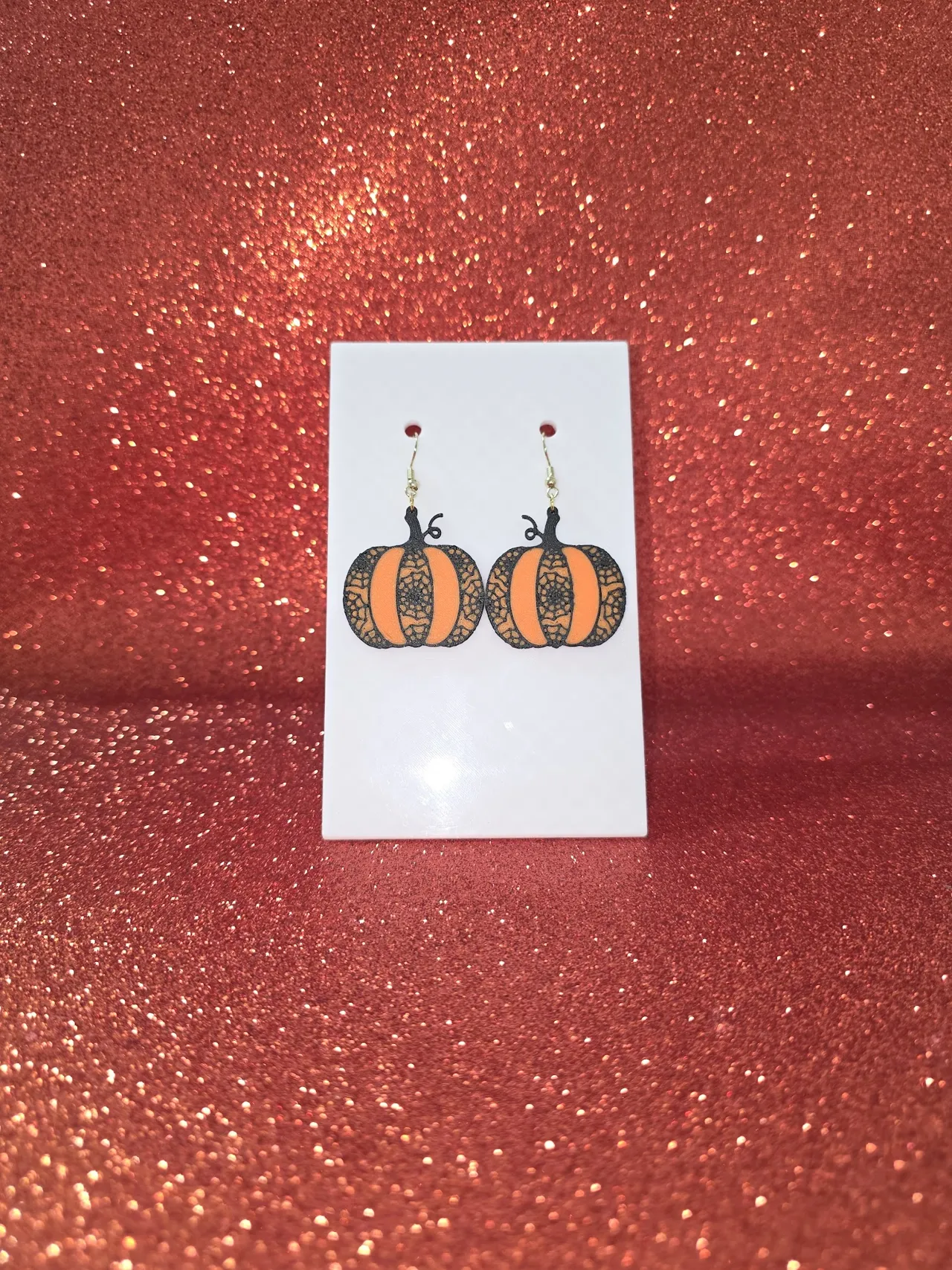 Pumpkin with cobwebs earrings view 2