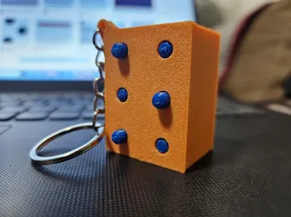 Llavero Braille