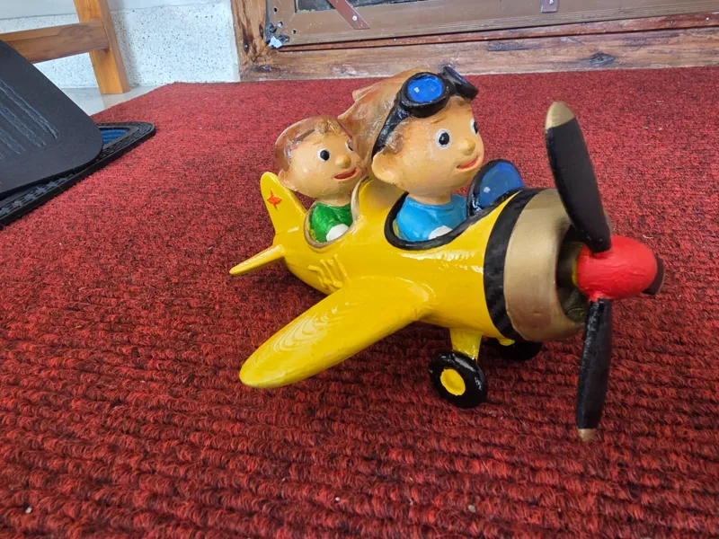 boys on a toy plane