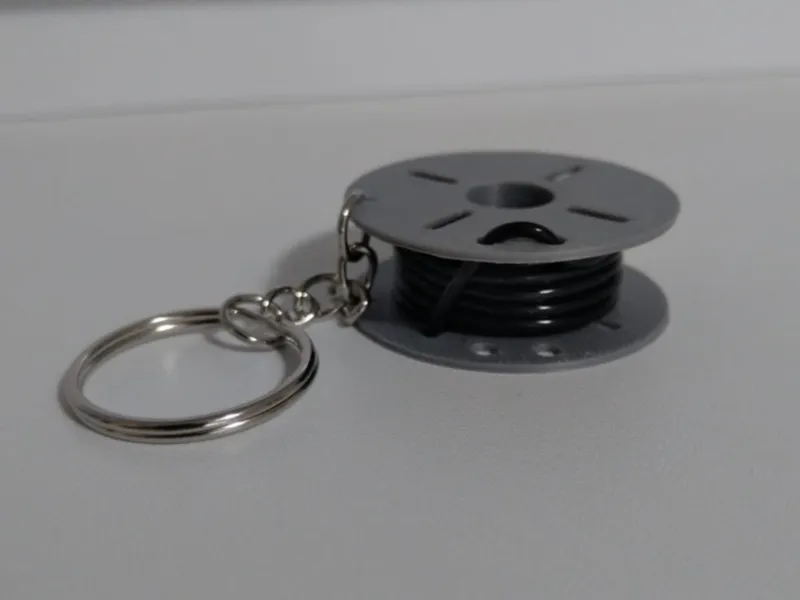 Mini keychain with spool